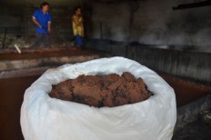 Ondrongan brown sugar in a 50-kg sack waits to be sold as an ingredient to a seasoning maker. JP/ Aman Rochman