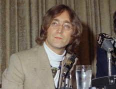 In this 1971 file photo, singer John Lennon appears during a press conference. Publisher Houghton Mifflin Harcourt said Monday, Nov. 28, 2016, that it was publishing “Imagine,” inspired by the John Lennon classic of the same name.