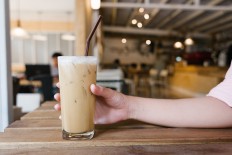 Sipping luscious coffee in Manggar's legendary Warung Kopi Anui