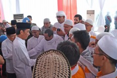 Jokowi gets clerics in line amid tension