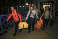 First victim found, 12 remain missing in police plane crash