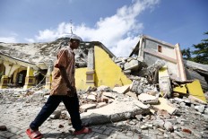 Aceh quake kills at least 94