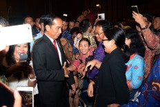 Jokowi puts on tax amnesty suit to appeal to Bali businesspeople