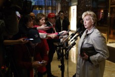 Trump chooses hardliners but talks softer on immigration
