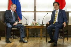 Putin-Abe talks move to Tokyo; territory, economy on agenda 