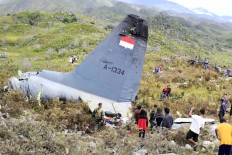 Papua crash blamed on weather, human error
