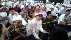 Santa hat steals show at Gus Dur's annual memorial