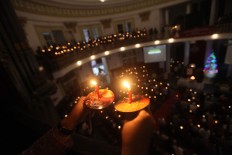 Christians at the Protestant Church Immanuel in Central Jakarta celebrate Christmas Eve by lighting candles. JP/Donny Fernando