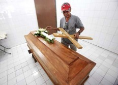 No further appeal: A coffin is arranged for Michael Titus Igweh in Jakarta on July 29. The Nigerian was among four drug convicts executed on Nusakambangan prison island.