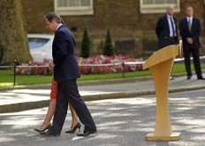 In this Friday, June 24, 2016 file photo, Britain's Prime Minister David Cameron and his wife Samantha walk back into 10 Downing Street, London, after he said he would be resigning in the wake of Britain's vote to leave the European Union after a bitterly divisive referendum campaign. So-called Brexit was one of the biggest business stories in 2016 prompting volatility in financial markets, including a sharp drop in the value of the British pound. 