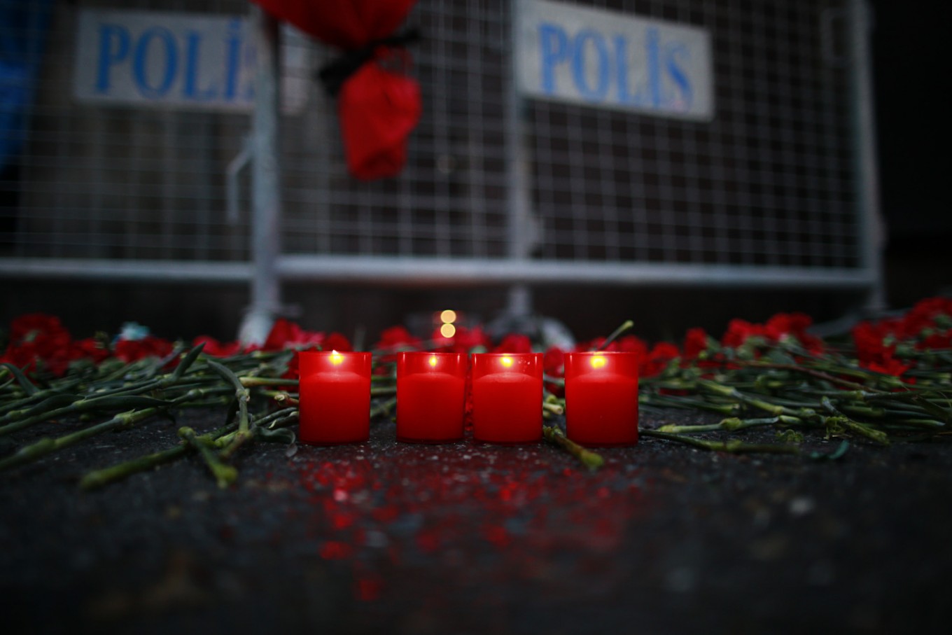 In mourning -- Candles are lit for the victims outside a nightclub which was attacked by a gunman overnight, in Istanbul, on New Year's Day, Sunday. An assailant armed with a long-barrelled weapon, opened fire at a nightclub in Istanbul's Ortakoy district during New Year's celebrations, killing dozens of people and wounding dozens of others in what the province's governor described as a terror attack.