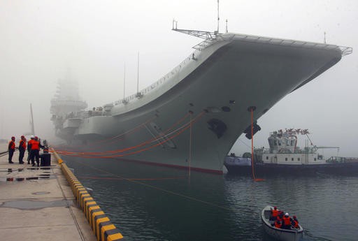 China says committed to peace as carrier passes near Taiwan