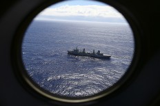 Australia defends end of MH370 hunt; investigation continues 