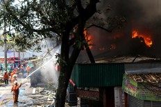 Firefighters scramble for water to douse Senen market fire