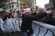 Hundreds of thousands of women around the world decry Trump