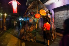 A bamboo installation serves as a small tunnel on the main ally of Kotagede in Yogyakarta during the Keroncong Market music festival in December. JP/ Tarko Sudiarno