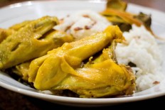 Coconut rice and fried chicken are served at the Nasi Uduk dan Ayam Goreng Mat Lengket eatery in East Jakarta.
