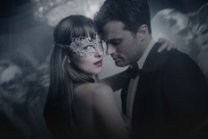 Actors Dakota Johnson (left) as Anastasia Steele and Jamie Dornan (right) as Christian Grey in 'Fifty Shades Darker.'