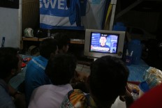 Ahok, Anies supporters meet in front of Agus’ camp without conflict