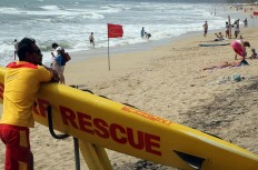 Kuta lifeguards warn of high waves, strong wind
