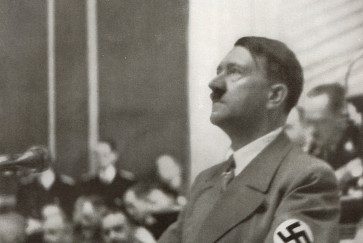 Hitler speaks to the Reichstag on the Jewish Question. Reproduction of antique photo.