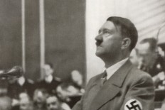Hitler speaks to the Reichstag on the Jewish Question. Reproduction of antique photo.