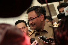 Ahok’s deputy promises card-based microcredit scheme for street vendors