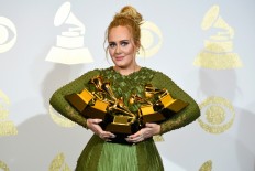 Adele sweeps Grammys Awards with 5 wins, while Bowie wins 4
