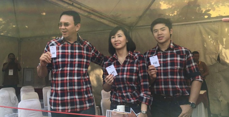 Ahok and family cast votes at Pluit