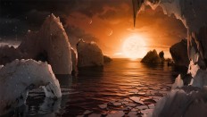 This image provided by NASA/JPL-Caltech shows an artist's conception of what the surface of the exoplanet TRAPPIST-1f may look like, based on available data about its diameter, mass and distances from the host star. The planets circle tightly around a dim dwarf star called Trappist-1, barely the size of Jupiter. Three are in the so-called habitable zone, where liquid water and, possibly life, might exist. The others are right on the doorstep.