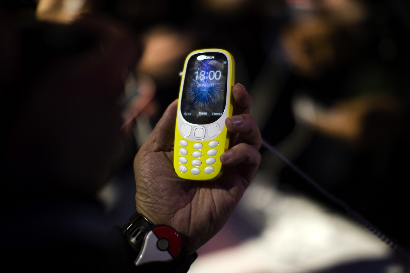 Attendants check the new re-launched Nokia 3310 phone during a Nokia presentation at the Mobile World Congress wireless show in Barcelona, Spain, on Feb. 26, 2017. 