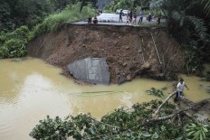 Floods force students to stay at home, put harvests at risk in Riau
