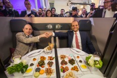 Qatar Air debuts double-bed seats that morph into meeting room
