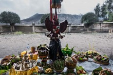 Indonesia’s national emblem, Garuda Pancasila, is hung at an offering altar. JP/Tarko Sudiarno