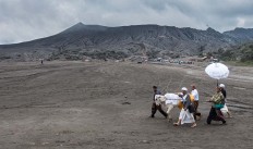 Some men lead a cow around the Luhur Poten temple in Mount Bromo. JP/Tarko Sudiarno