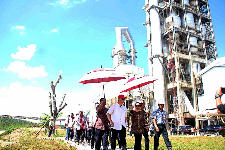 Rini M. Soemarno (center right, front), in her capacity at the time as state-owned enterprises minister, visits on March 17, 2017 the factory of state-owned cement producer PT Semen Indonesia in Rembang, Central Java.