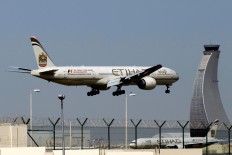 UAE's Etihad to suspend flights to Qatar
