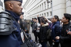 Paris clashes over police killing of Chinese man injured three