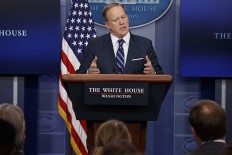White House makes clear it's not trying to push Assad out 