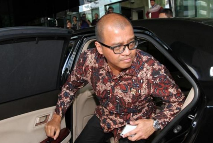 Andi Widjajanto emerges from an official car at the Presidential Palace in Central Jakarta in 2017.