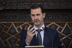 Under mounting pressure: In this June 7, 2016 file photo released by the Syrian official news agency SANA, Syrian President Bashar Assad, addresses a speech to the newly-elected parliament at the parliament building, in Damascus, Syria. Assad's government came under mounting international pressure on April 6 after a chemical attack in northern Syria, with even key ally Russia saying its support is not unconditional. 