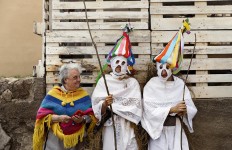 In this April 1, 2017 picture a woman speaks with a couple of youngsters dressed as 'Zarramaches' a character from the traditional carnival of Casavieja, during a gathering of different villages' carnival masks and characters, in Casavieja, Spain, Monday, April 3, 2017. These festivals, held across central and northwestern Spain, most often coincide with festivities celebrating the advent of spring, mixing Carnival and bizarre pagan-like rituals with mock battles between good and evil. AP /Daniel Ochoa de Olza