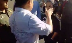Workers demand Tangerang Police sack officer who hit female protester 