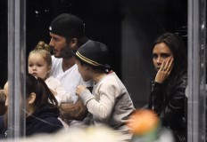  In this Saturday, April 12, 2014 file photo, David Beckham, second left, sits with his daughter, Harper, son, Cruz, and wife Victoria, watch the Los Angeles Kings play the Anaheim Ducks in Los Angeles. Harper Beckham is only 5 years old, but her famous mother already is taking steps to protect her brand. Fashion designer and former Spice Girl Victoria Beckham has registered daughter Harper’s name with intellectual property authorities in Britain and Europe, it was announced Thursday, April 13, 2017.