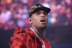 In this June 7, 2015, file photo, Chris Brown performs at the 2015 Hot 97 Summer Jam at MetLife Stadium in East Rutherford, N.J. Police in Florida are investigating an incident at a nightclub where a photographer said he was 