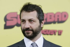 In this Monday, Aug. 13, 2007, file photo, Judd Apatow arrives at the premiere of "Superbad" in Los Angeles. Apatow likes nothing more than topping his own joke: The filmmaker is putting together a sequel to his best-selling “Sick In the Head,” which featured conversations with Mel Brooks, Jerry Seinfeld and other comedians.