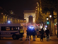 IS group claims Champs-Elysees attack on police officers 