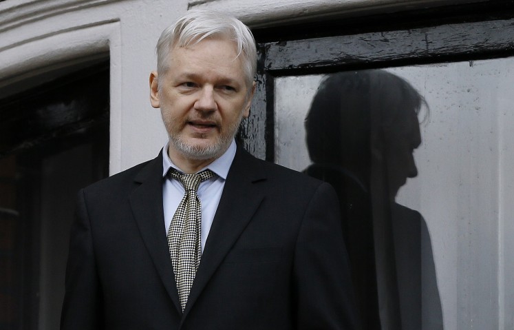 In this Feb. 5, 2016 file photo, WikiLeaks founder Julian Assange speaks from the balcony of the Ecuadorean Embassy in London. Two media reports say U.S. prosecutors are preparing or closely considering charges against the anti-secrecy group WikiLeaks, including Assange, for revealing sensitive government secrets.