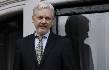 In this Feb. 5, 2016 file photo, WikiLeaks founder Julian Assange speaks from the balcony of the Ecuadorean Embassy in London. Two media reports say U.S. prosecutors are preparing or closely considering charges against the anti-secrecy group WikiLeaks, including Assange, for revealing sensitive government secrets.