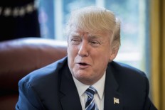 Trump backs away from demand for border wall money